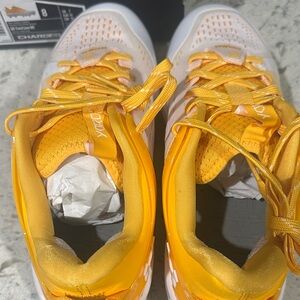 Under Armour Men's baseball metal cleats in Yellow and White